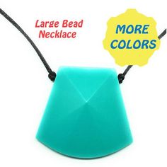 an origami necklace with a large bead necklace and more colors