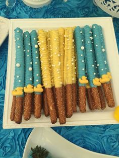 there are many different types of desserts on the table together, including corn and other food items