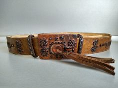 Vintage genuine leather women belt - Genuine leather belt - The belt is adjustable from 74 cm to 81 cm . Width - 4.5 cm For other VINTAGE ACCESSORIES please see here : https://www.etsy.com/shop/TheVINTAGEShopBG?ref=seller-platform-mcnav&section_id=22639651 All pictures are real . You buy exactly what you see in the photos . Thank you for visiting my store. Please check out my other items 😊 Adjustable Embroidered Leather Belt, Vintage Leather Belt Buckles, Vintage Adjustable Belts For Formal Wear, Vintage Leather Adjustable Belt Buckles, Vintage Brown Embroidered Belt, Formal Brown Embroidered Belt, Vintage Belts With Antique Buckle, Adjustable, Vintage Leather Embroidered Belt, Leather Folder