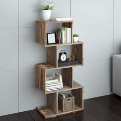 a wooden shelf with books and pictures on it