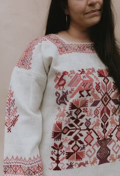 100% handspun wool tunic, or tomicoton, with hand embroidery in cochineal red tones Folk Style Embroidered Long Sleeve Tunic, Embroidered Long Sleeve Folk Tunic, Traditional Long Sleeve Tunic For Fall, Traditional Red Embroidered Tunic, Traditional Long Sleeve Tunic With Multicolor Embroidery, Multicolor Embroidered Long Sleeve Tunic, Traditional Red Long Sleeve Tunic, Wool Tunic, Hand Spun Wool