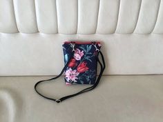 a purse sitting on top of a white couch