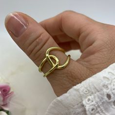 "**Elevate Your Style with Our 18K Gold Plated Capital Great Knot Thumb Ring 🌟 **Unique and Bold Design This 18K gold plated Capital Great Knot Thumb Ring is a true statement piece, combining unique design with boldness. Its intricate knot detail and chunky signet style make it a versatile accessory to enhance your everyday look. 💍 **Adjustable for Comfort Crafted for convenience, this dainty weaved thick adjustable ring ensures a perfect fit on any finger, including the thumb. Its adaptability allows you to wear it with ease, expressing your style effortlessly. 🎁 **Ideal Christmas Gift Whether you're searching for a Christmas present or a special gift for her, this Capital Great Knot Thumb Ring is an excellent choice. Its craftsmanship and charm will make her holiday season extra speci Trendy Gold Rings For Anniversary, Trendy Gold-plated Gold Midi Rings, Dainty Yellow Gold Metal Rings, Trendy Gold-plated Anniversary Rings, Trendy Gold Promise Ring, Trendy Gold Plated Rings For Anniversary, Trendy Gold Rings For Gift, Trendy Gold Rings Perfect For Gifts, Trendy Gold Rings For Gifts