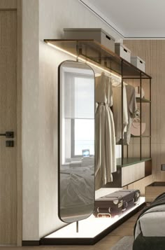 a bedroom with a bed, mirror and closet