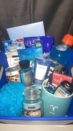 a blue container filled with lots of different items