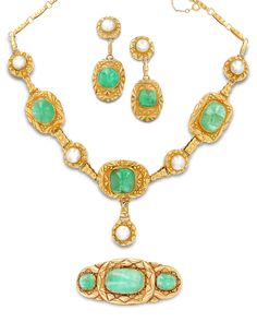 An array of vibrant green emeralds and luminous pearls are set in this luxurious Victorian parure. Crafted of 18-19K yellow gold, the suite comprises a pair of earrings, a bracelet and a necklace specially designed to be worn together. Luxury Victorian Yellow Gold Jewelry, Luxury Historical Design Women's Jewelry, Luxury Gold Victorian Pearl Necklace, Luxury Victorian Pearl Necklace, Luxury Victorian Green Jewelry, Luxury Historical Jewelry, Luxury Green Pearl Necklace With Charm, Luxury Green Pearl Necklace For Women, Luxury Green Pearl Necklace In Temple Jewelry Style