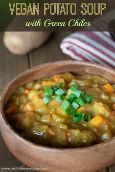 vegan potato soup with green chiles in a wooden bowl on a wood table