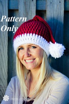 a woman wearing a red and white knitted santa hat