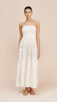 Discover the beauty of pared-back sophistication with our latest Spring collection, whispering tales of vintage charm and feminine grace. White Dress With Smocked Bodice And Straight Neckline, Spring Bandeau Dress With Pleated Bodice, Bandeau Dress With Ruched Bodice For Wedding, Bandeau Wedding Dress With Ruched Bodice, Feminine Strapless Maxi Dress With Ruched Bodice, Summer Bandeau Dress With Boned Bodice, Strapless Ruched Dress For Daywear, Cream Dress With Smocked Bodice For Wedding, Cream Wedding Dress With Smocked Bodice