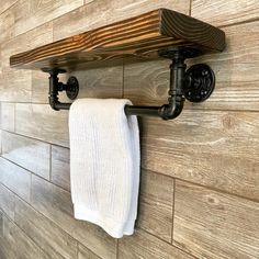 Custom rustic industrial wood shelf with under mount towel bar. Mudroom Shelf, Metal Pipe Shelves, Guys Office, Industrial Pipe Shelf, Black Towel Bar, Shelf With Towel Bar, Pipe Shelving, Basement Redo, Pipe Shelf