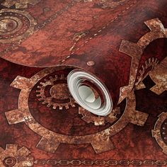 a close up view of an intricately designed wallpaper with gears and cogs