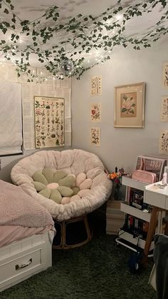 a bedroom with two beds and lots of pictures on the wall above them, along with other furniture