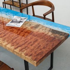 a wooden table with a magazine sitting on top of it