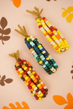 two corn on the cob made out of beads