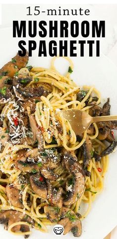 a white plate topped with pasta and mushrooms