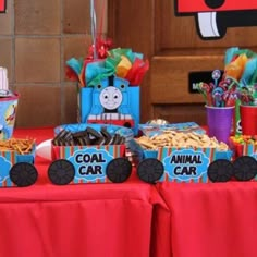 a table topped with lots of food and decorations