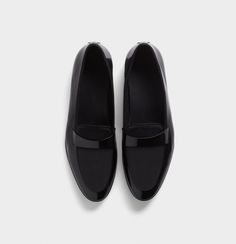 Black Grosgrain Loafers | The Black Tux Classic Fitted Business Slip-ons, Modern Formal Slip-ons With Brogue Detailing, Classic Black Plain Toe Slip-ons, Formal Fitted Leather Slip-ons, Elegant Tassel Loafers With Moc Toe For Office, Black Slip-on Dress Shoes For Formal Occasions, Elegant Office Tassel Loafers With Moc Toe, Classic Black Slip-ons With Brogue Detailing, Fitted Slip-on Oxfords For Formal Occasions