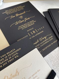 black and gold wedding stationery with calligraphy on the front, back and inside