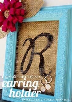 a blue frame with the letter r on it and a red flower next to it