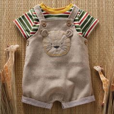 Nwt Mudpie Tiger Overall 2pc Set “This Tiger Baby Overall Set Is Durable For Baby. The Tan Chambray Overalls Feature Coconut Wood Button Straps. It Features An Oxford And Seersucker Lion Applique And Turned Woven Stripe Ankle Cuffs. It Also Has An Inner Leg Snap Closure. The Overalls Pair With Striped Jersey Short Sleeve Tee Featuring Green, White, Red And Yellow” New With Tags Smoke Free Lion Applique, Tiger Baby, Green White Red, Baby Overall, Coconut Wood, Baby Fits, Knit Denim, Striped Jersey