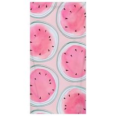 watermelon slices are arranged on a pink background with black dots in the center