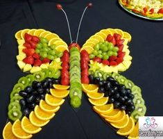 a butterfly made out of fruits and vegetables