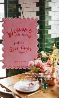 a pink sign that says welcome to the good times