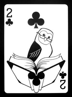 a black and white playing card with a bird sitting on top of an open book