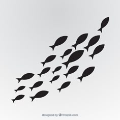 a flock of black fish swimming in the ocean on a white background with space for text