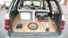 the back end of a car with an entertainment system in it