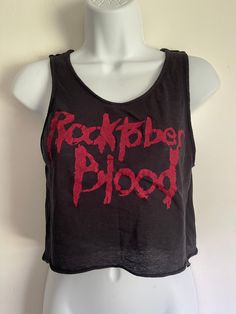 This item is ONE OF A KIND and once it's gone, it's gone for good! Girls top handmade from scratch with black 4-way knit. Red print on front with long sleeves and tons of stretch. All seams serged and top stitched. Size L Bust - 36-48" Length -17" Fitted Black Crop Top Band Merch, Red Grunge Tops For Fall, Black Crew Neck Crop Top For Concert, Stretch Tops For Fall Concert, Stretch Tops For Concerts In Fall, Black Cotton Band Merch Crop Top, Black Long Sleeve Rock Tops, Stretch Graphic Print Tops For Concert, Black Cotton Crop Top For Concert