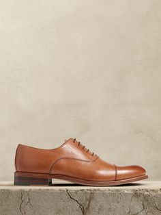 The perfect dress shoe, these timeless leather oxfords have a subtle, cap-toe construction, beautifully crafted for us in Portugal of exceptional, timeless leather.  Leather uppers.  Waxed laces.  Leather soles.  Made in Portugal.  Whole and half sizes. Trendy Hats, Trendy Hat, Stylish Scarves, Shoe Inspo, Cool Sunglasses, Leather Cap, Dress Shoe, Men's Accessories, Perfect Dress