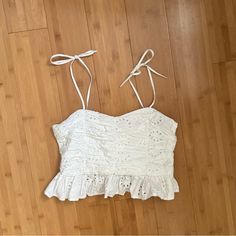 Zara Embroidered Crop Top Small. Condition: New With Tags! I Got The Wrong Size So Repurchased In My Correct Size. V Neckline With Adjustable Tied Spaghetti Straps. Embroidered Eyelet Detail. Flounced Hem. Side Hidden In Seam Zip Closure. Adjustable Strap Crop Top. Crop Blouse. Cropped Blouse. Peplum. Ribbon Tie. Bow. Cottage Core. Zara Sleeveless Top With Floral Embroidery, Zara Sleeveless Tops With Floral Embroidery, Fitted Tops With Broderie Anglaise For Day Out, Summer Cropped Top With Broderie Anglaise, White Eyelet Blouse For Summer, Cropped Broderie Anglaise Top For Summer, Broderie Anglaise Cropped Top For Summer, White Eyelet Feminine Top, Casual Broderie Anglaise Lace Top For Summer