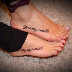 two people with tattoos on their feet that say, you are my sunshine and my happiness