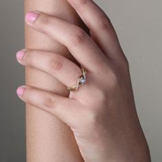 a woman's hand with a ring on it