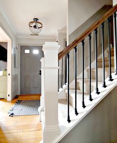 the stairs in this house are painted white