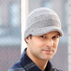 a man wearing a gray knitted hat