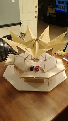 a model boat sitting on top of a wooden table