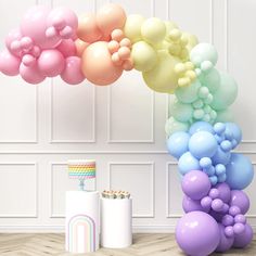 a bunch of balloons that are in the air next to some toilet paper and other items