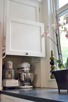 the kitchen counter is clean and ready to be used as a coffee maker or mixer