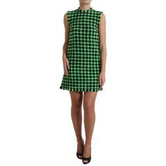 Discover Luxury With A Touch Of Timeless Elegance With This Stunning Dolce & Gabbana Houndstooth Mini Dress. Beautifully Crafted From High-Quality Virgin Wool Blend, It’s Designed To Make A Statement At Any Event. The Chic Green Color And Flattering Silhouette Provide A Look Of Opulence And Style. This Must-Have Piece Features A Secure Zipper Closure And The Iconic Logo Detail, Exhibiting Italian Craftsmanship At Its Finest. Color: Green Material: 92% Virgin Wool 8% Nylon Lining: 97% Polyester 3 Aline Mini Dress, Dolce Gabbana Dress, Italian Craftsmanship, Black Chevron, Iconic Logo, Bc Canada, Green Material, Knit Mini Dress, Long Sleeve Mini