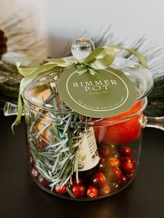 a glass jar filled with assorted fruits and vegetables