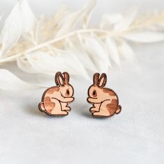 Super cute little pair. Size: Around 1.2cm Materials:  cherry wood + stainless steel Item is wrapped in Eco-friendly recyclable materials. Plastic free. In order to keep your item in good condition, please keep it away from water, and perfume. Rabbit Earrings, Wood Earrings Stud, Earrings Wooden, Wood Studs, Earring Gift, Animal Earrings, Earrings Cute, Wooden Earrings, Cherry Wood