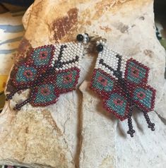 Sweet artisan made beaded butterfly earrings. The earrings have a 2-1/2 inch drop and are 1-3/8 inch wide. Handmade Multicolor Butterfly Earrings, Bohemian Butterfly Shaped Beaded Jewelry, Bohemian Butterfly Beaded Jewelry, Unique Handmade Butterfly Earrings, Handmade Butterfly Beaded Earrings For Gift, Beaded Butterfly Earrings, Beaded Butterfly, Earrings Native American, Beaded Earring