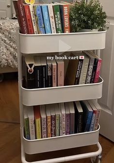 there is a book cart with many books on it