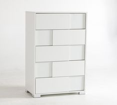 a white dresser sitting on top of a white floor