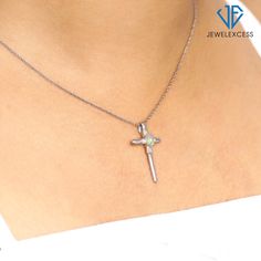 Unlike other cross pendants for women that turn out to be made of low-quality materials that break, rust, and become discolored, the JewelExcess Cross Pendant is expertly crafted out of 14k Gold over .925 Sterling Silver, for a stunning, premium-quality gold pendant necklace that lasts and lasts. Featuring a gorgeous 4k Genuine Opal stone centerpiece surrounded by real .01 ctw White Diamond accents, this gold cross pendant simply glows with elegance and impeccable workmanship. While other cross Cross Necklace For Women, Necklace Displays, Cross Necklaces, Silver Cross Necklace, Sterling Silver Cross Necklace, Silver Bodies, Unique Gifts For Mom, Gold Cross Necklace, Gold Cross Pendant