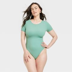 This 4-Way Stretch Short-Sleeve Bodysuit from Auden™ adds an effortlessly cozy option to your wardrobe. Made from lightweight fabric with spandex, this short-sleeve bodysuit in green features a round neck plus a cotton gusset to help you stay cool and comfortable. Great for wearing under a variety of outfits, the bodysuit also features a four-way stretch design for flexible wear. Auden™: Comfort true to every shape & hue. Stretch Short Sleeve Bodysuit For Loungewear, Green Short Sleeve Swimwear With Stretch, Fitted Casual Bodysuit For Loungewear, Casual Green Stretch Bodysuit, Short Sleeve Bodysuit For Loungewear, Solid Color Short Sleeve Bodysuit For Loungewear, Solid Color Snug Fit Bodysuit For Loungewear, Snug Fit Solid Color Bodysuit For Loungewear, Solid Casual Bodysuit With Snug Fit