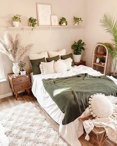 a bedroom with white and green decor on the walls, carpeted flooring and bedding