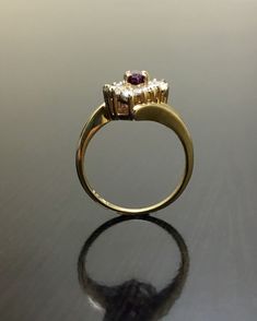 DeKara Designs Classic Metal- 14K Yellow Gold, .583 Stones- 1 Natural Marquise Ruby 0.30 Carats, 6 Baguette Diamonds, 8 Round Diamonds, F-G Color VS2 Clarity. Size- 4. FREE SIZING Art Deco Inspired Handmade Ruby Diamond Engagement Ring, Made in 14K Yellow Gold. The ring features a beautiful prong set marquise ruby. The marquise has three prong set baguette and four round diamonds that are also prong set on each side. This ring is a one of a kind and entirely handmade! FREE SHIPPING 7 Day Return Yellow Gold Amethyst Diamond Ring, Fine Jewelry Yellow Gold Diamond Amethyst Ring, Fine Jewelry Yellow Gold Amethyst Diamond Ring, Formal Ruby Ring With Diamond Cut In Yellow Gold, Gold Marquise Ruby Ring With Diamonds, Yellow Gold Cluster Ruby Promise Ring, Gold Amethyst Ring With Brilliant Cut Diamond, Yellow Gold Ruby Cluster Ring For Promise, Gold Amethyst Ring With Halo Setting, Fine Jewelry